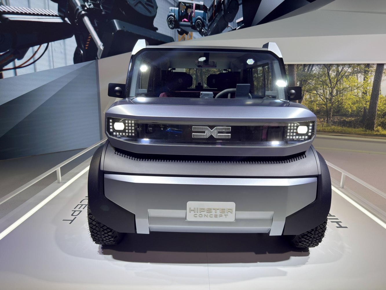 Front view with LED headlights and futuristic grille of an SUV concept.