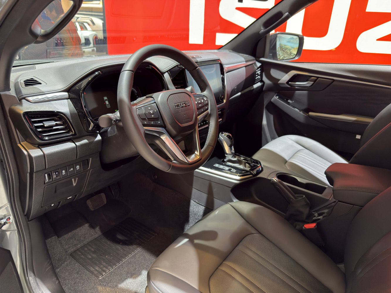 Steering wheel and dashboard with modern controls and display