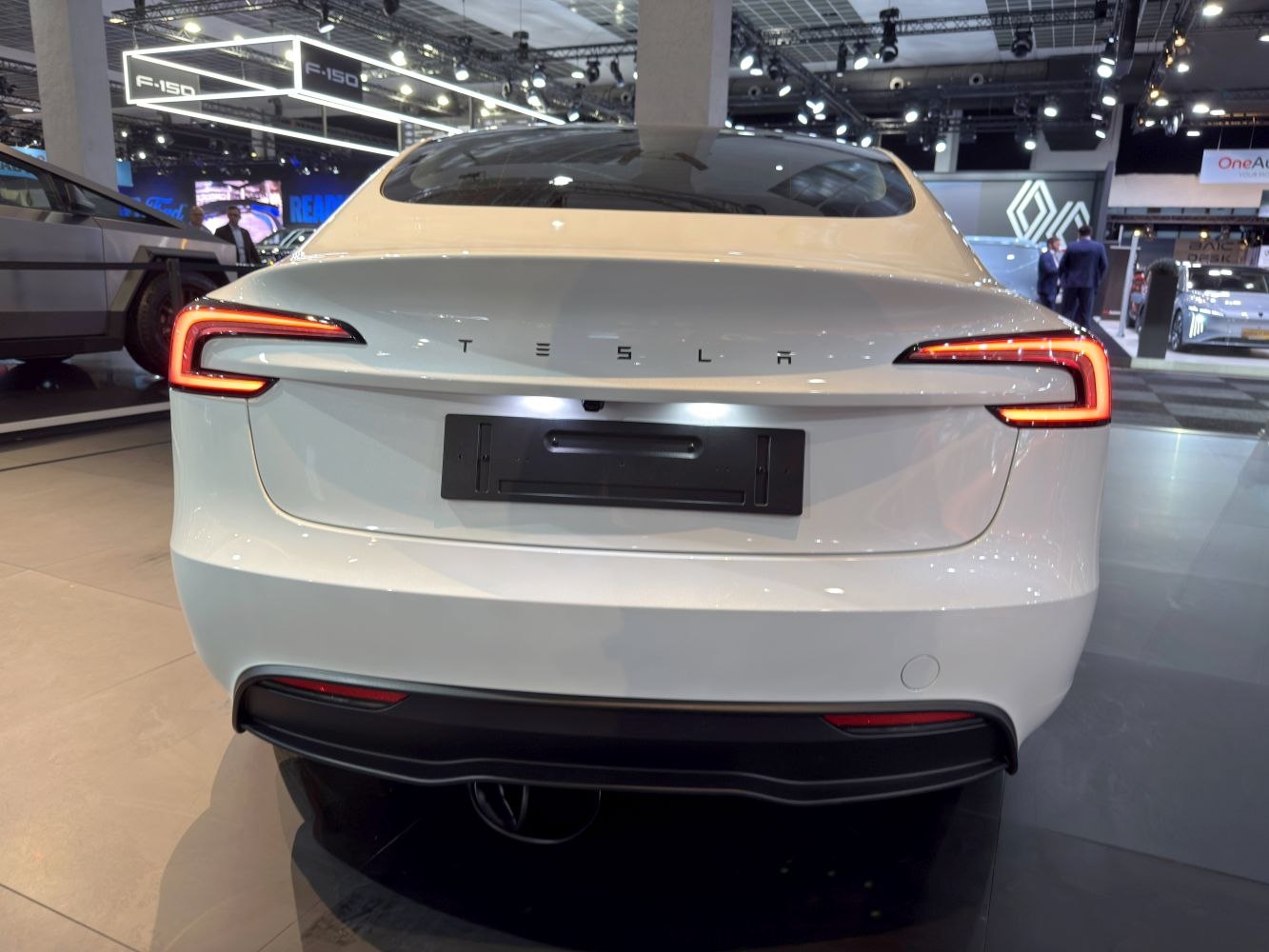 Rear view with distinct LED tail lights and a sleek white finish