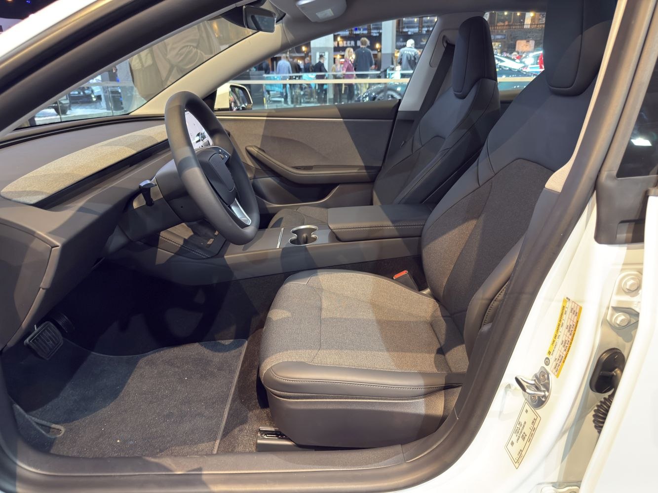 Modern front seats and minimalist dashboard with steering wheel