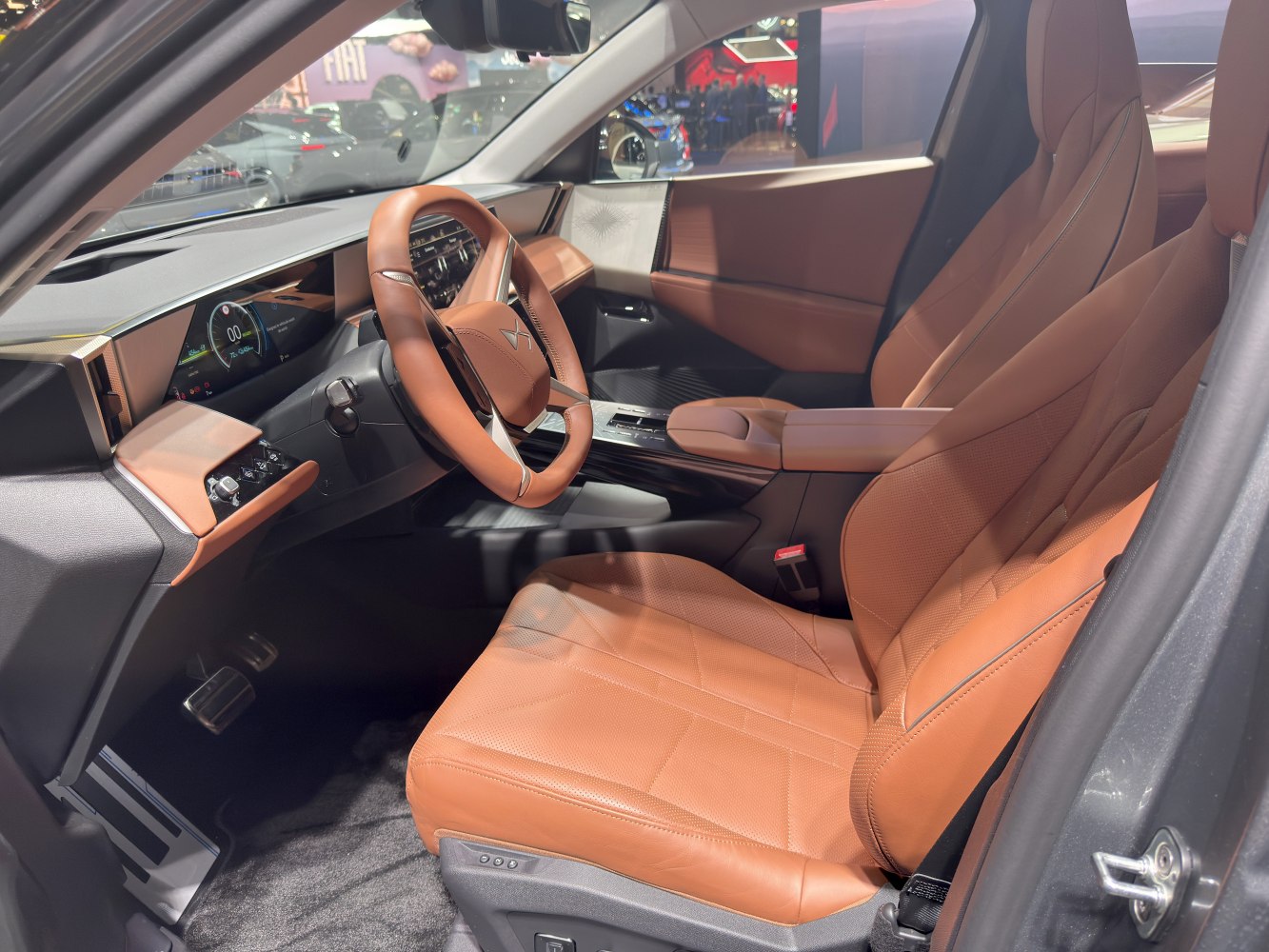 Brown leather seats and digital dashboard in car interior