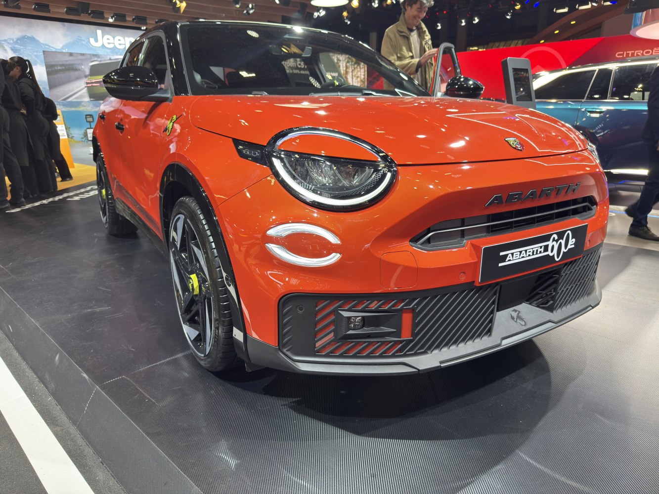 Front view with circular LED headlights and aggressive bumper design