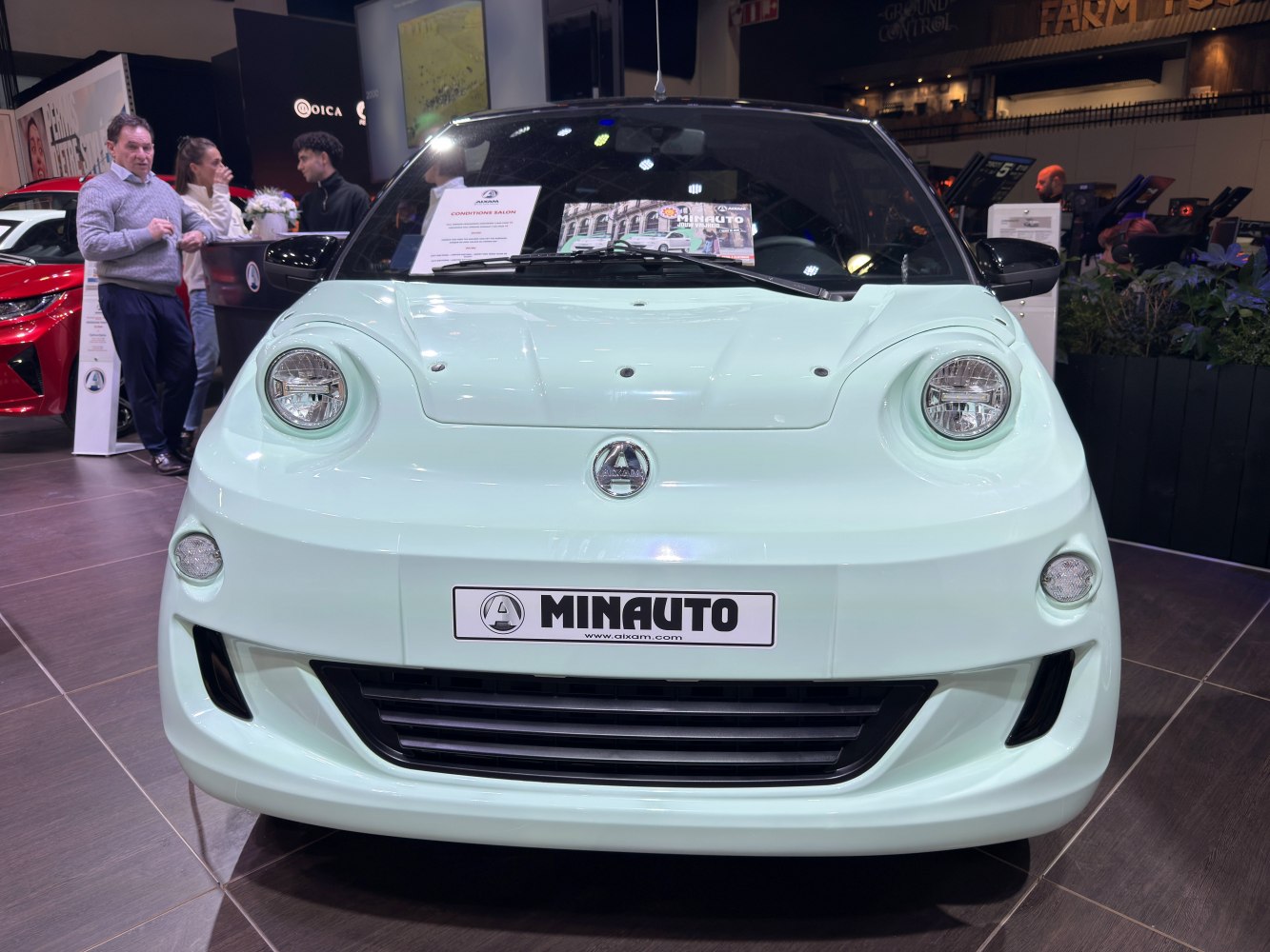 Close-up front view with round headlights and compact design