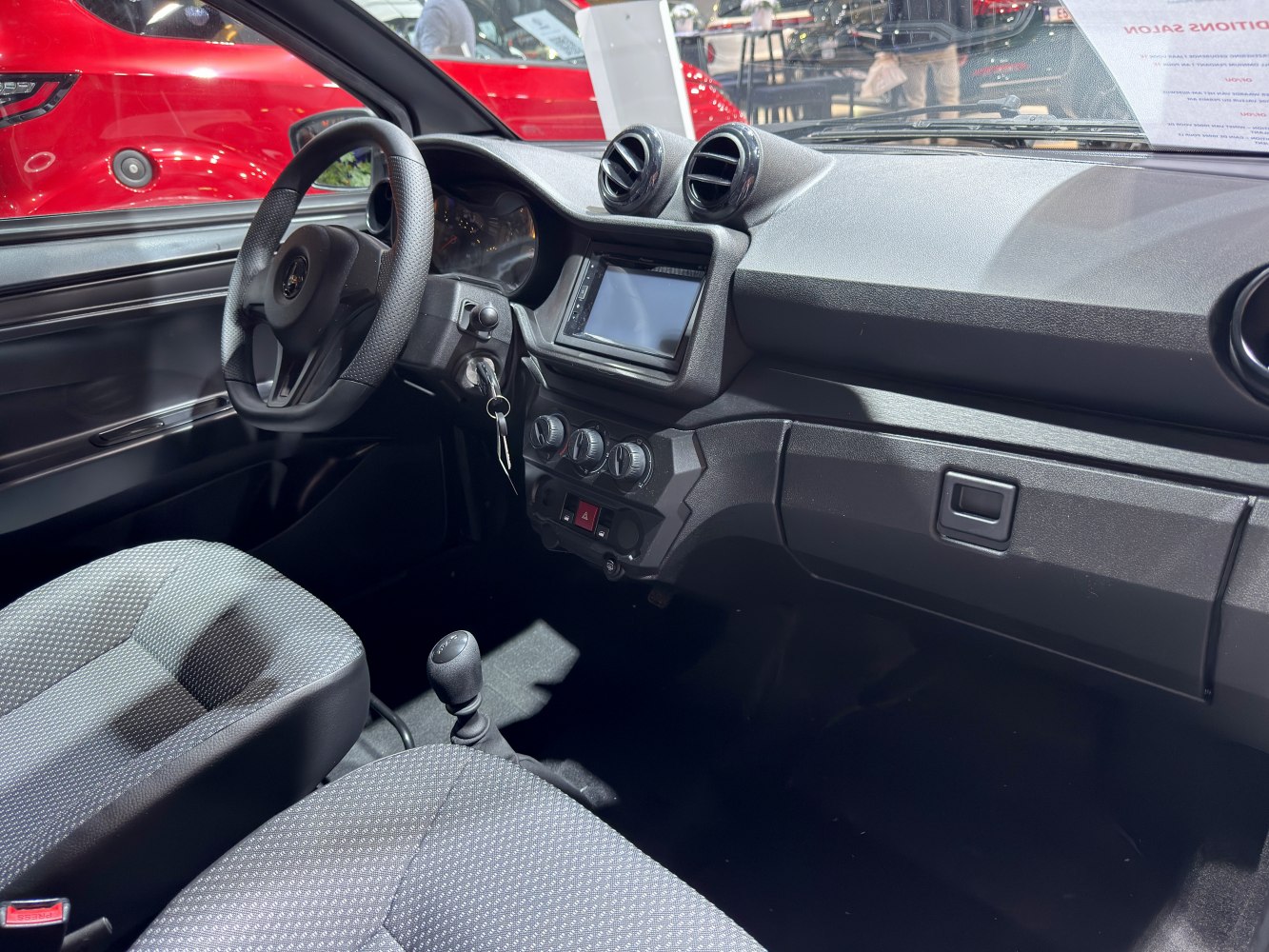 Dashboard, steering wheel, touchscreen, manual transmission interior.