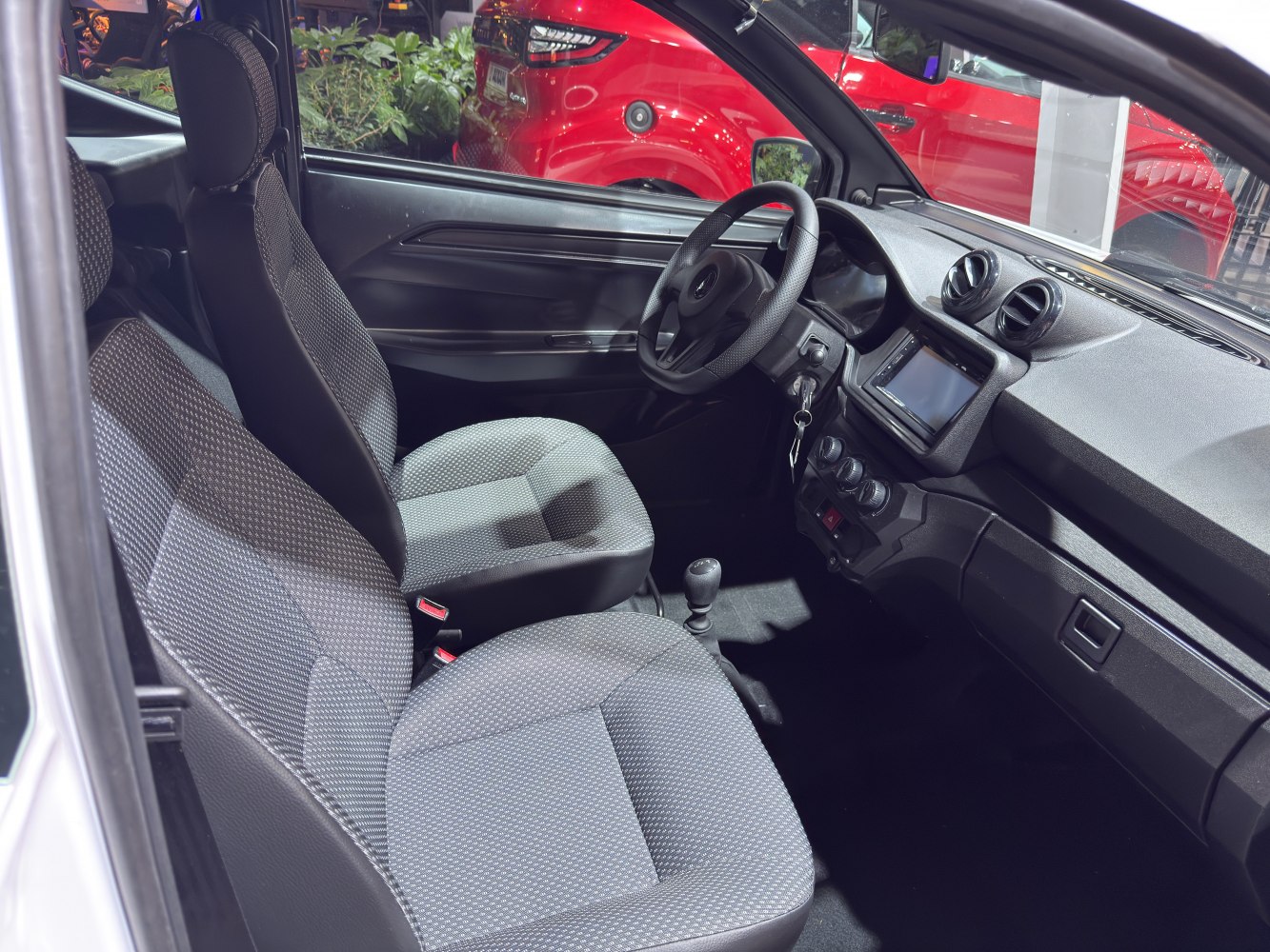 Front seats and dashboard interior with steering wheel and center console