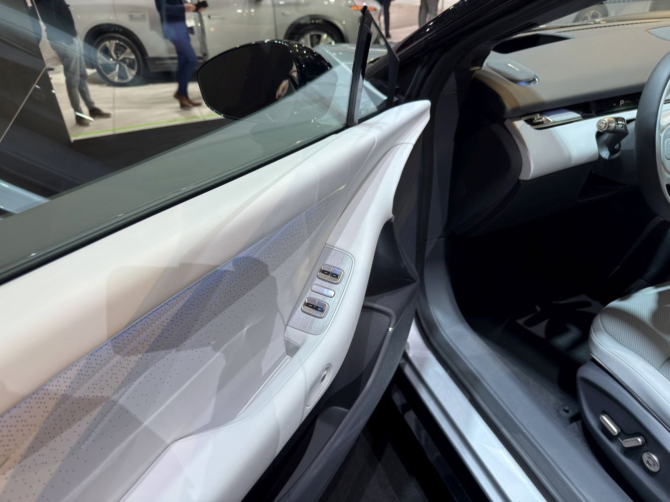 Interior door panel with electric window controls and modern design