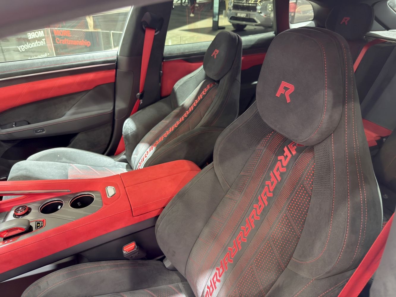 Sport seats with red accents and detailed stitching
