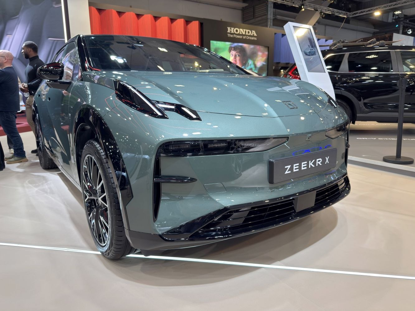Sleek car front end with distinctive headlights and aerodynamic styling