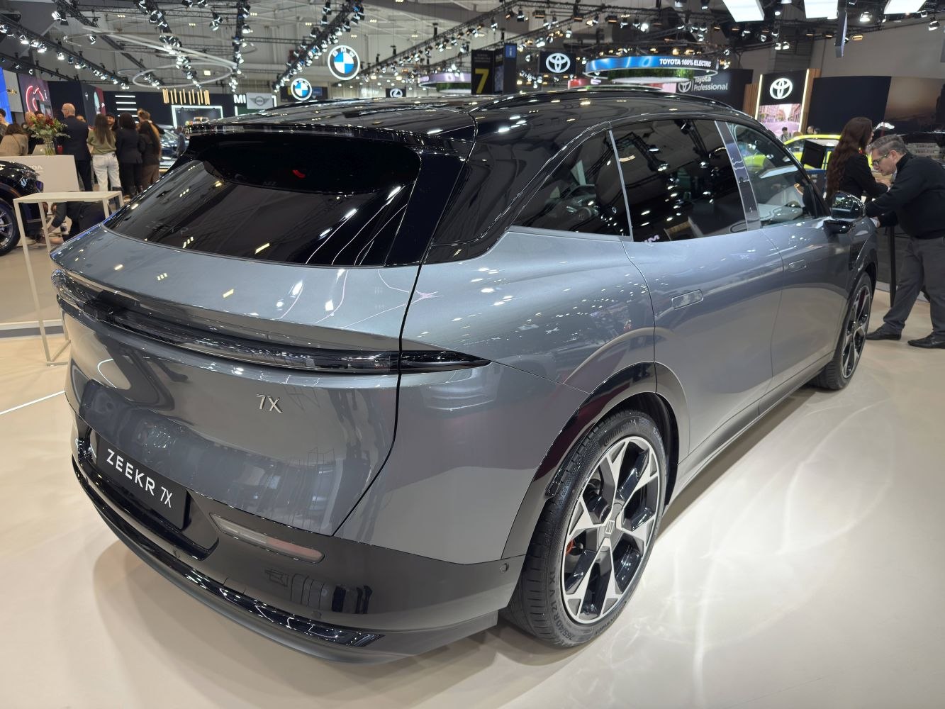 Sleek rear and side view of modern electric SUV with aerodynamic lines and alloy wheels