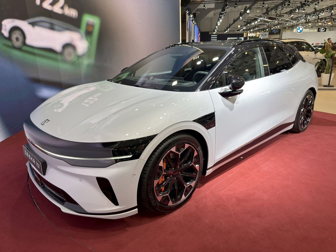 White electric crossover with black roof and LED lights