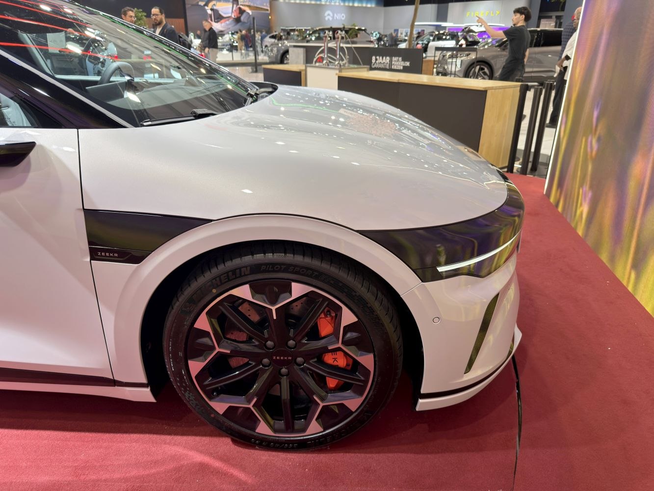 Close-up of futuristic front wheel and fender with sleek headlight line