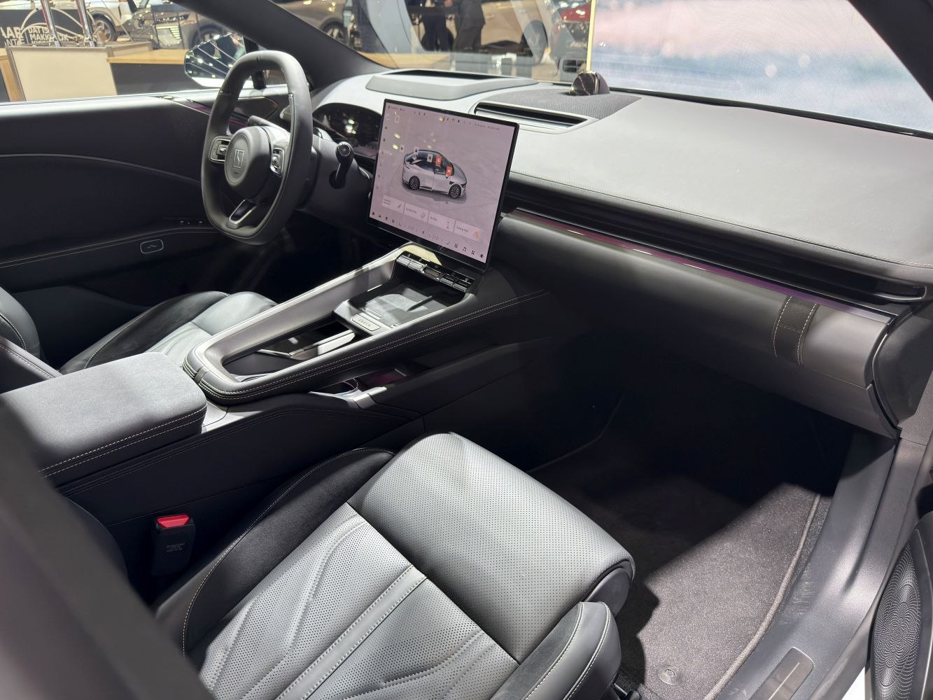 Minimalist dashboard, large digital touchscreen, premium leather seating
