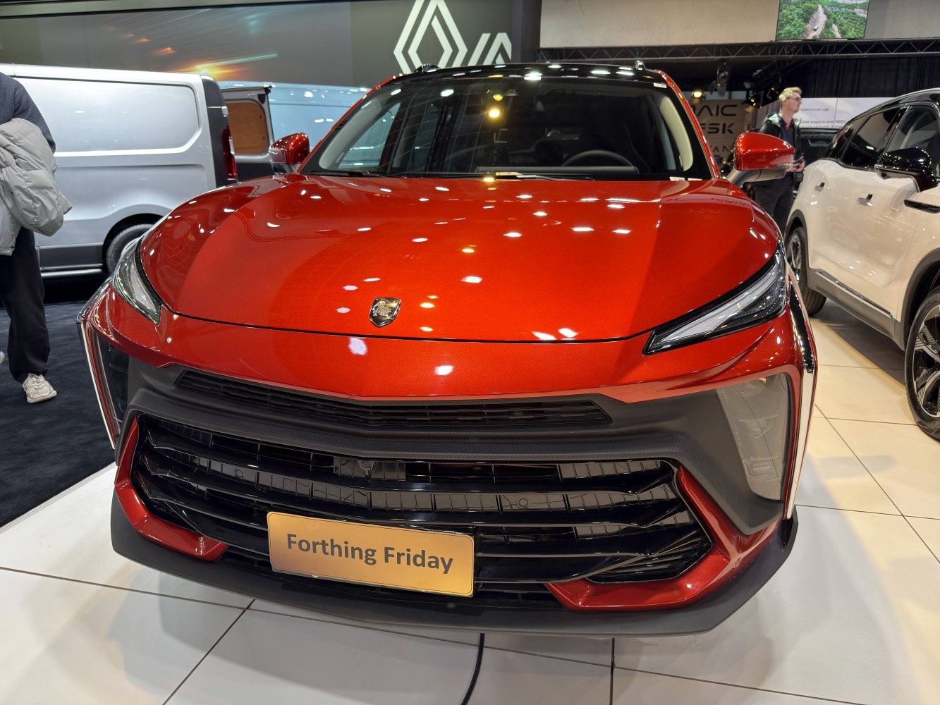 Front view with sleek headlights and bold grille design