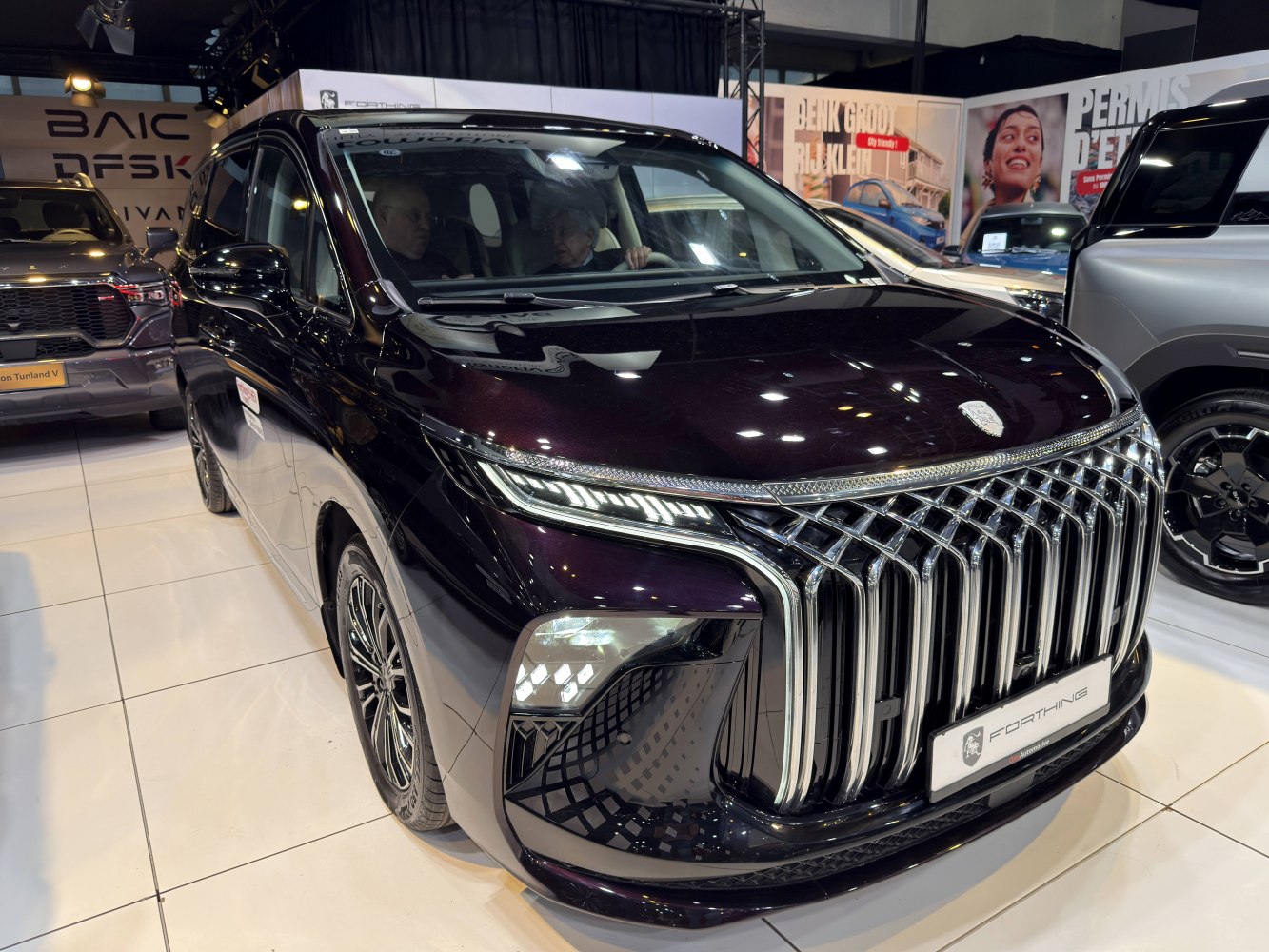 Bold chrome vertical grille and modern LED headlights on luxury SUV