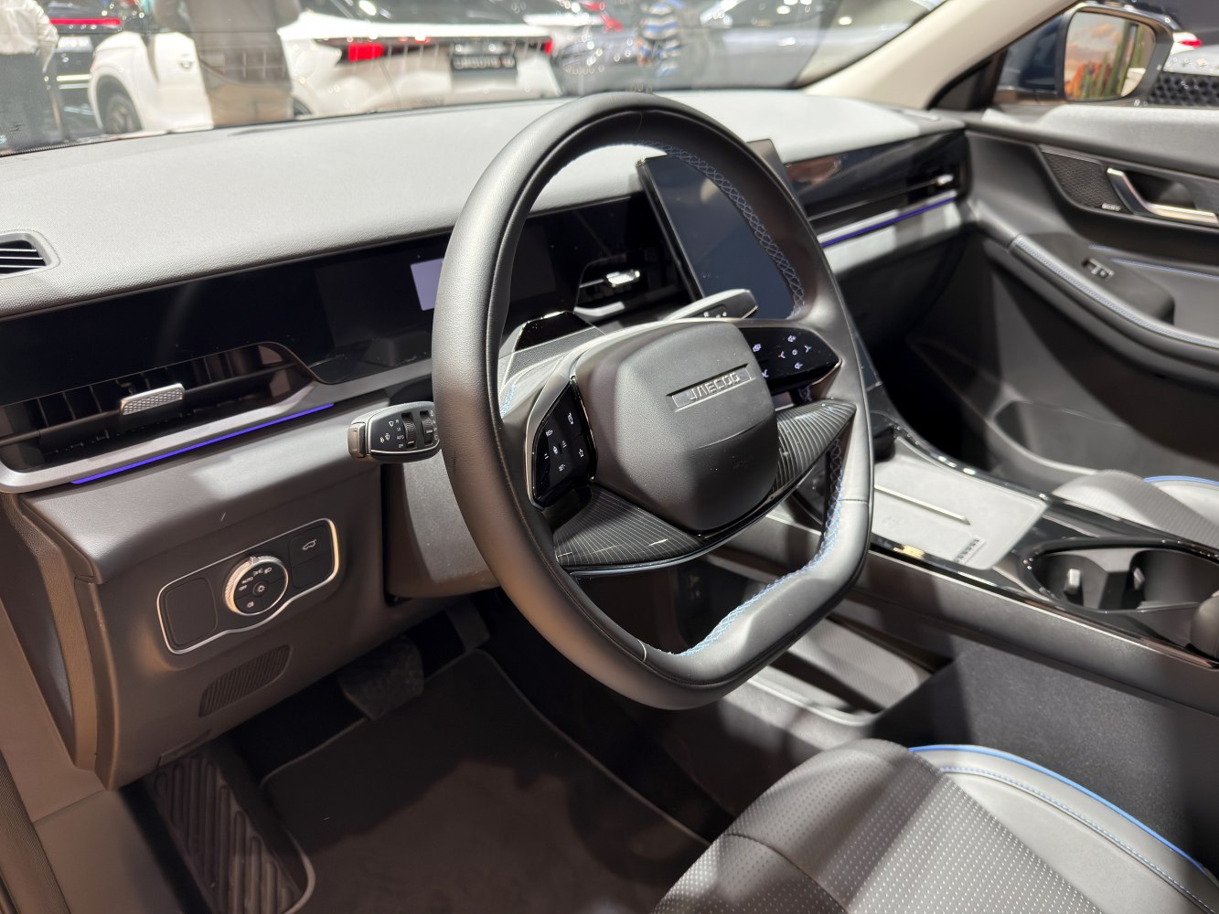 Futuristic steering wheel and sleek dashboard with integrated digital displays