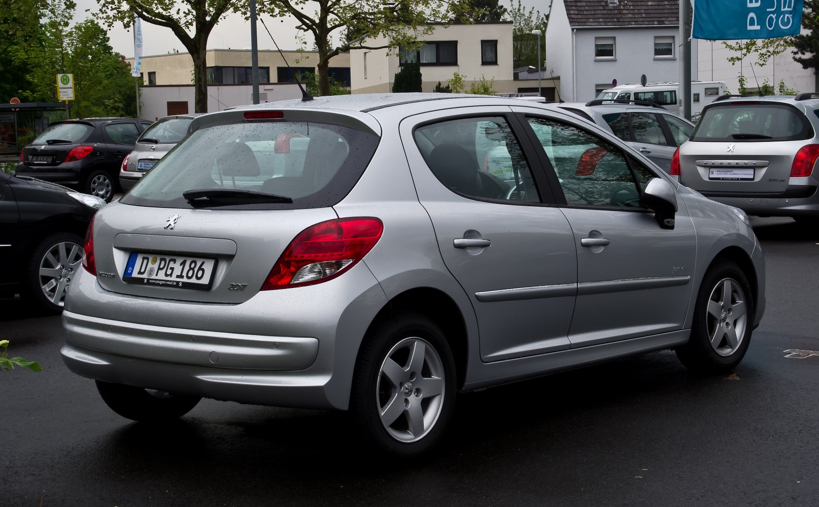 Rear side hatchback view with alloy wheels and compact form