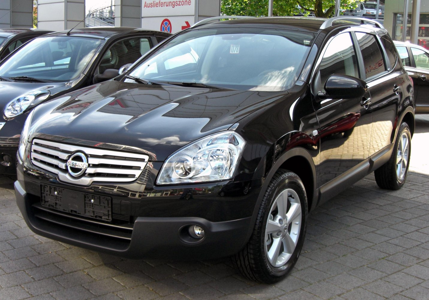 Front view with chrome grille and clear headlights