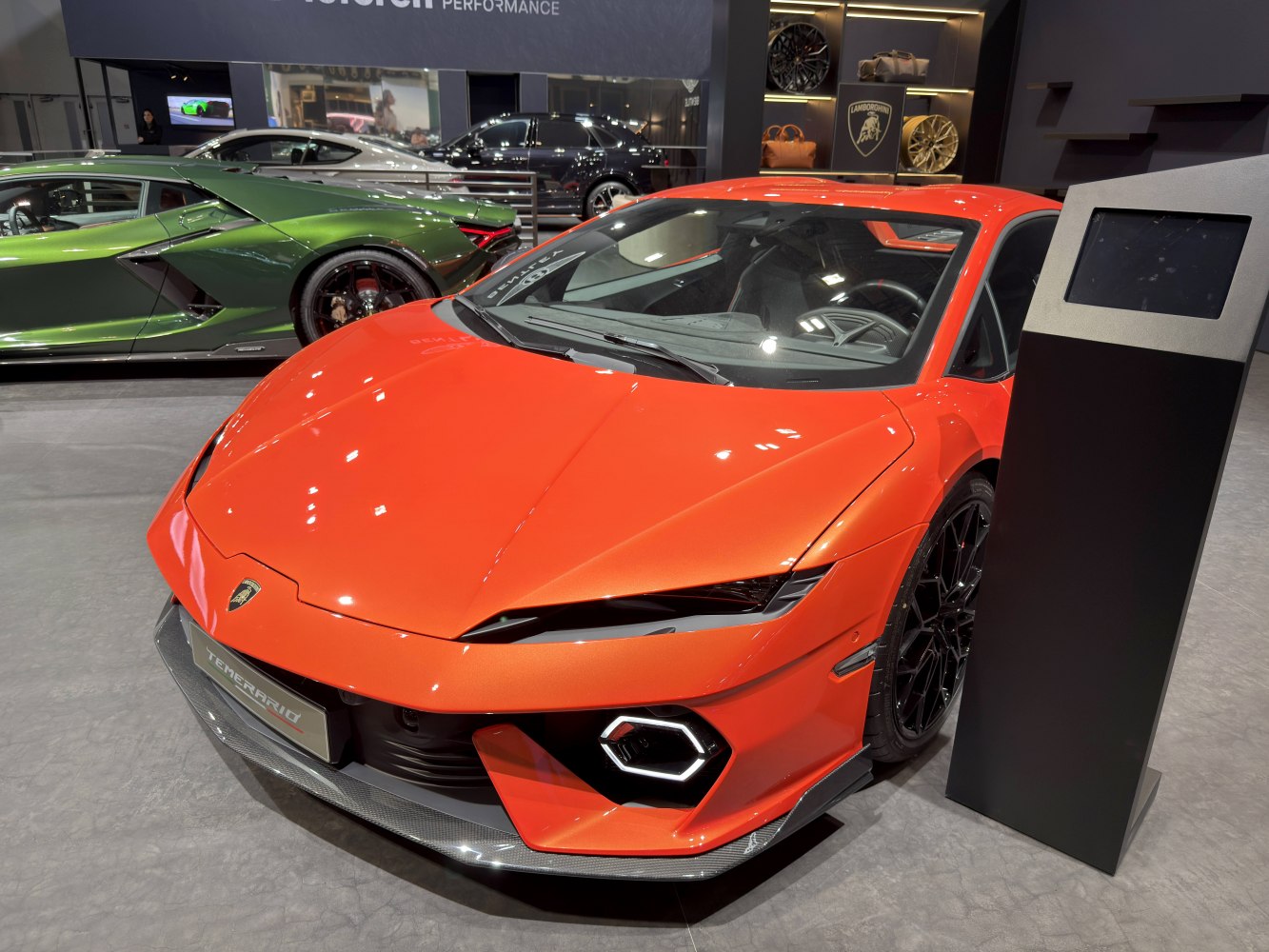Front view of a sports car with sharp headlights and hexagonal daytime running lights.