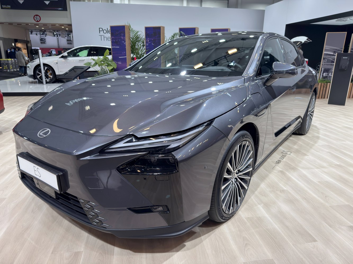 Sleek front fascia and detailed alloy wheels of a modern luxury sedan