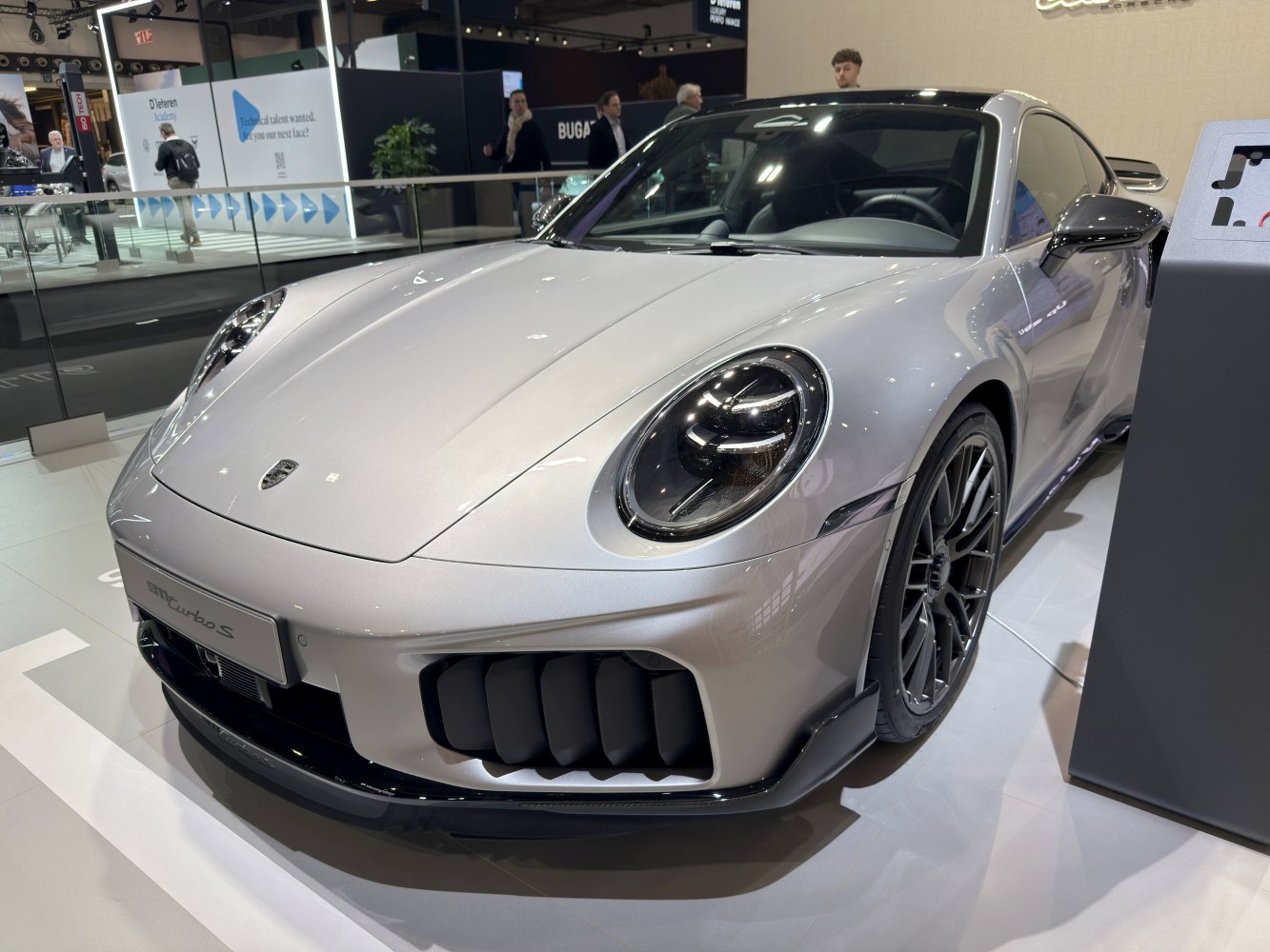 Close-up front with distinctive LED headlights and sporty air intakes