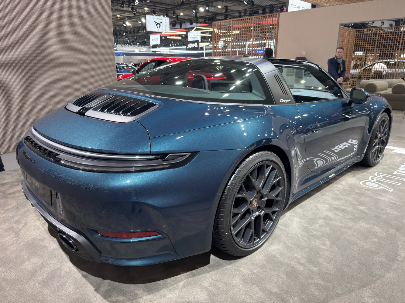 Rear and side view of sleek sports coupe with Targa roof and sporty wheels