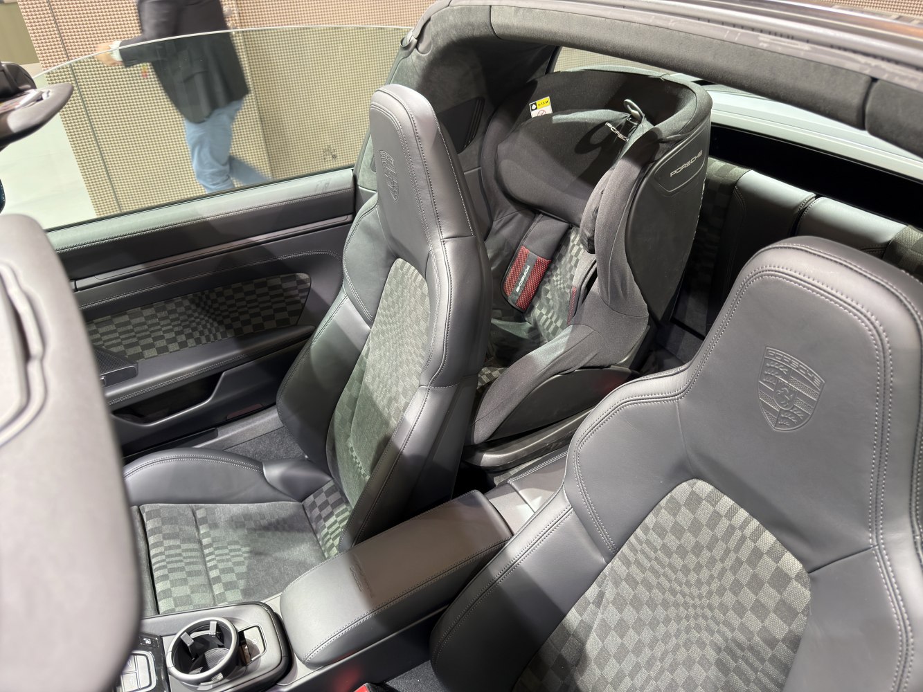 Luxurious black leather and checkered upholstery with Porsche embroidery on seats