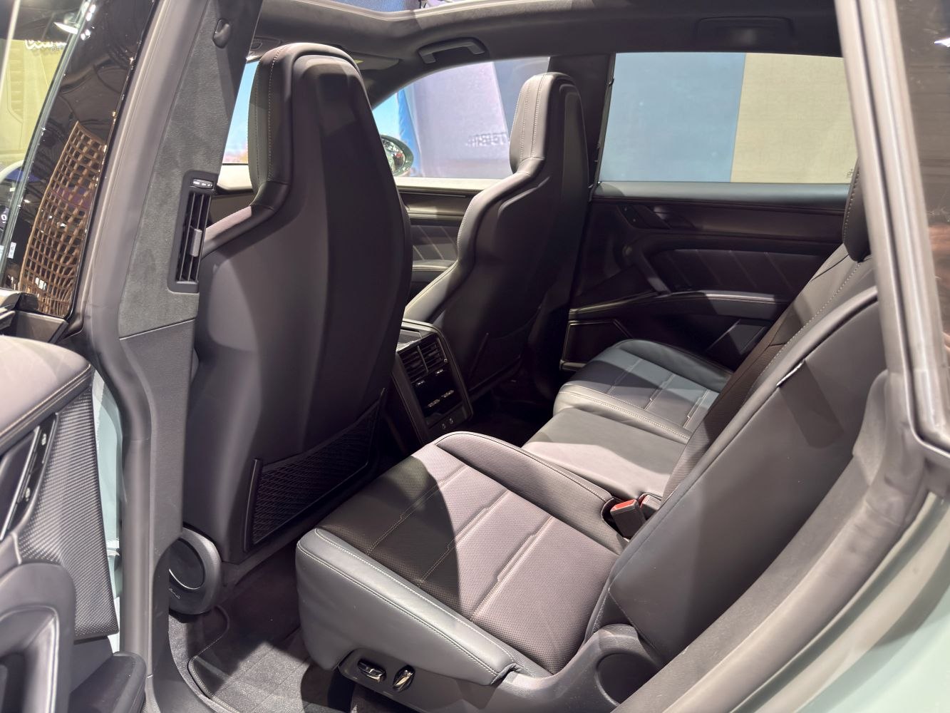 Rear seat interior with black leather seats and spacious cabin