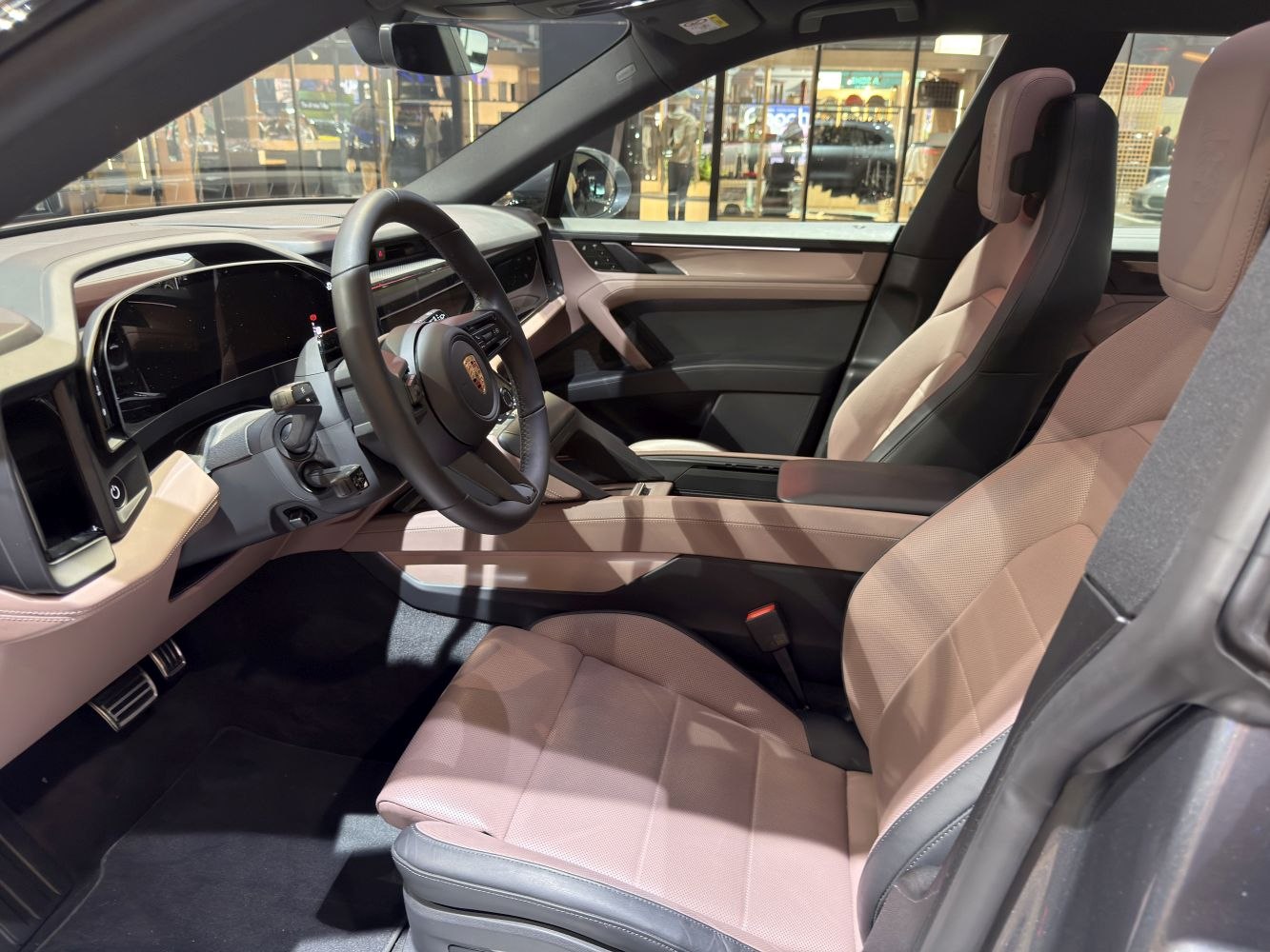 Luxurious electric car interior with high-tech cockpit and premium leather seats.
