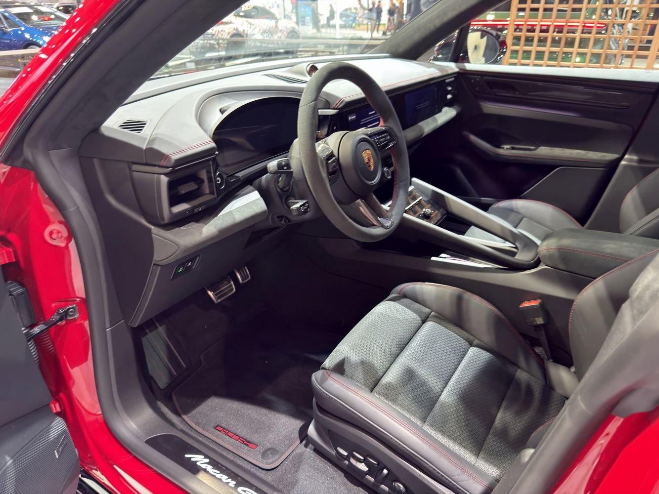 Modern electric SUV interior with digital cockpit and sports steering wheel