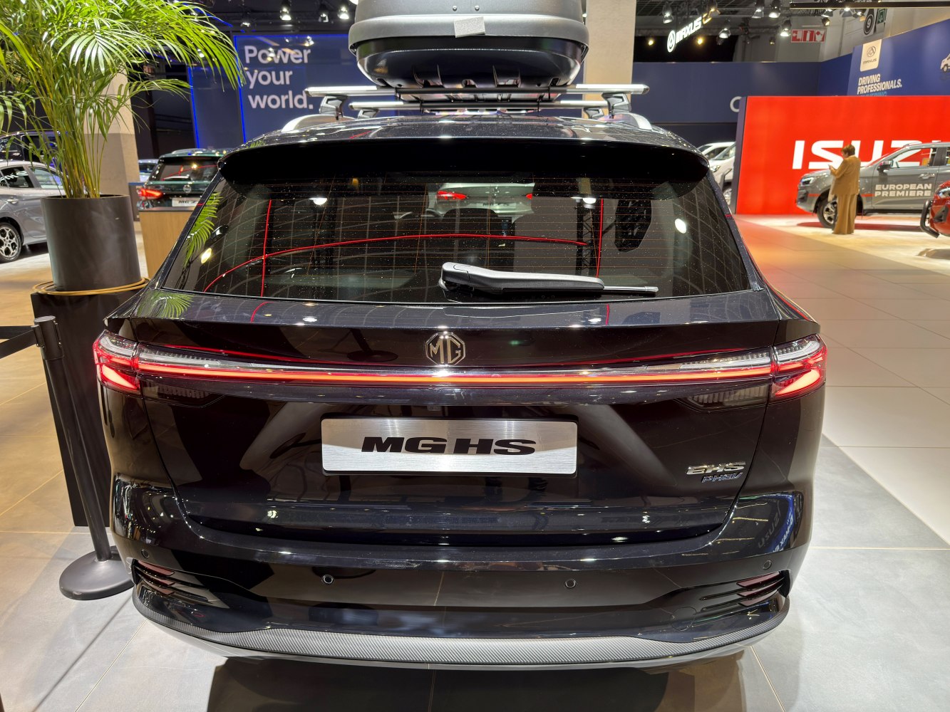 Rear view with continuous LED tail light bar and roof cargo box