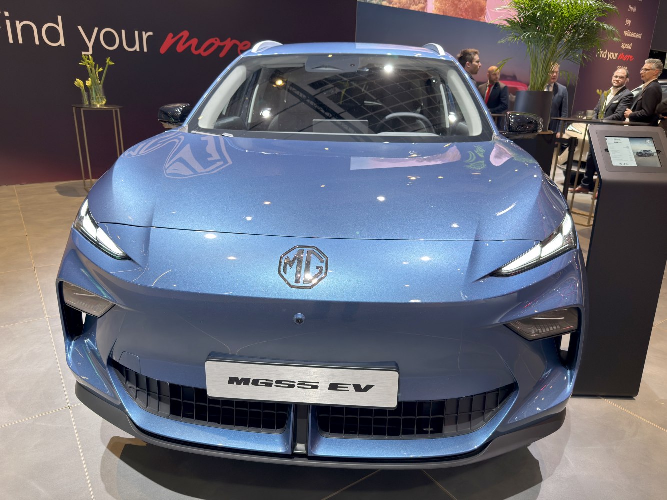 Sleek front view with LED headlights and bold grille design.