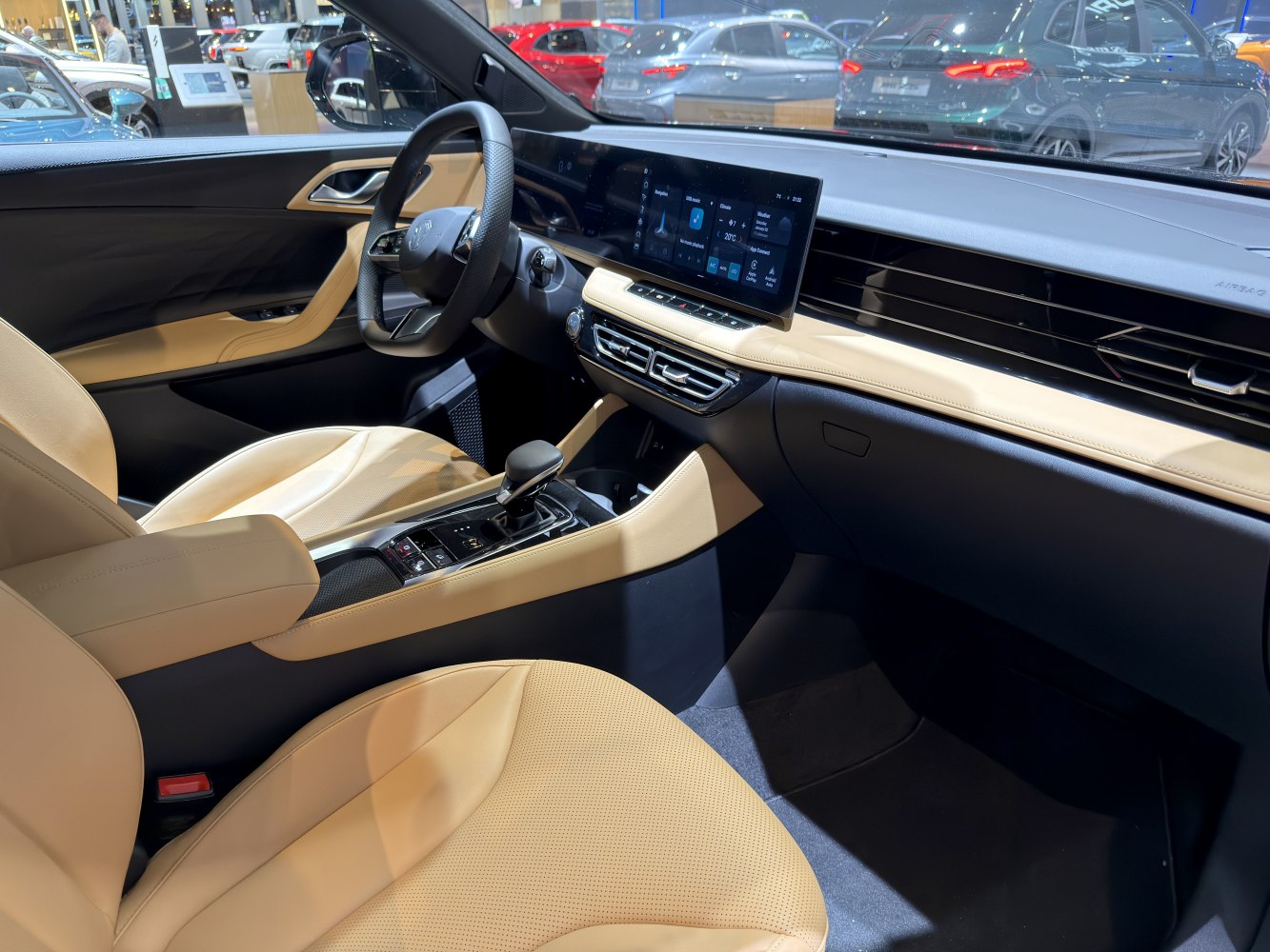 Modern electric car interior with digital dashboard and beige leather seats