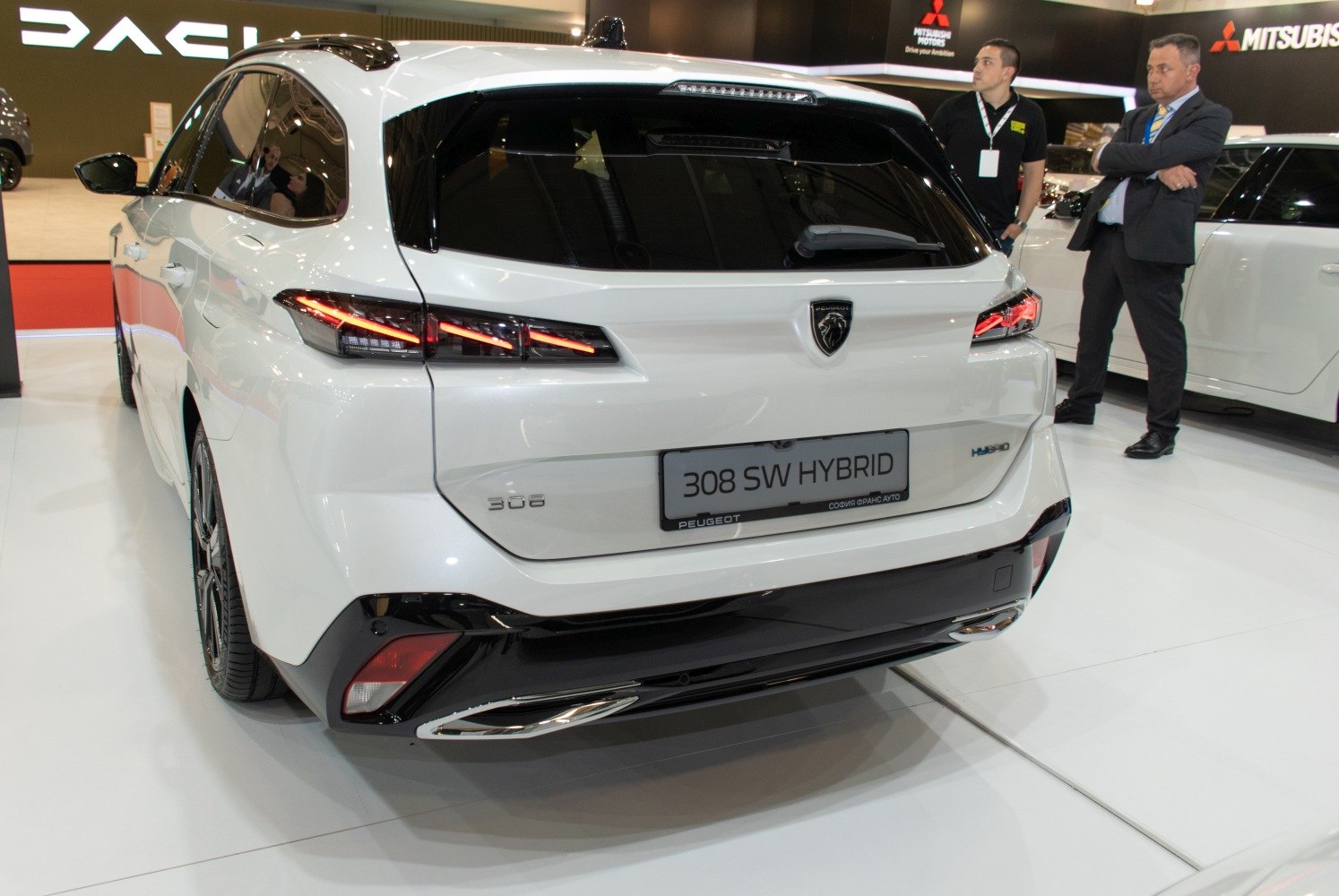 Sleek rear design with distinctive tri-claw LED tail lights and hybrid badge