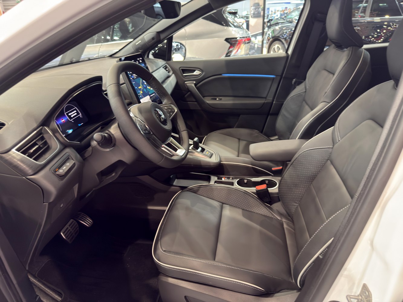 Modern dashboard with digital displays and premium leather front seats