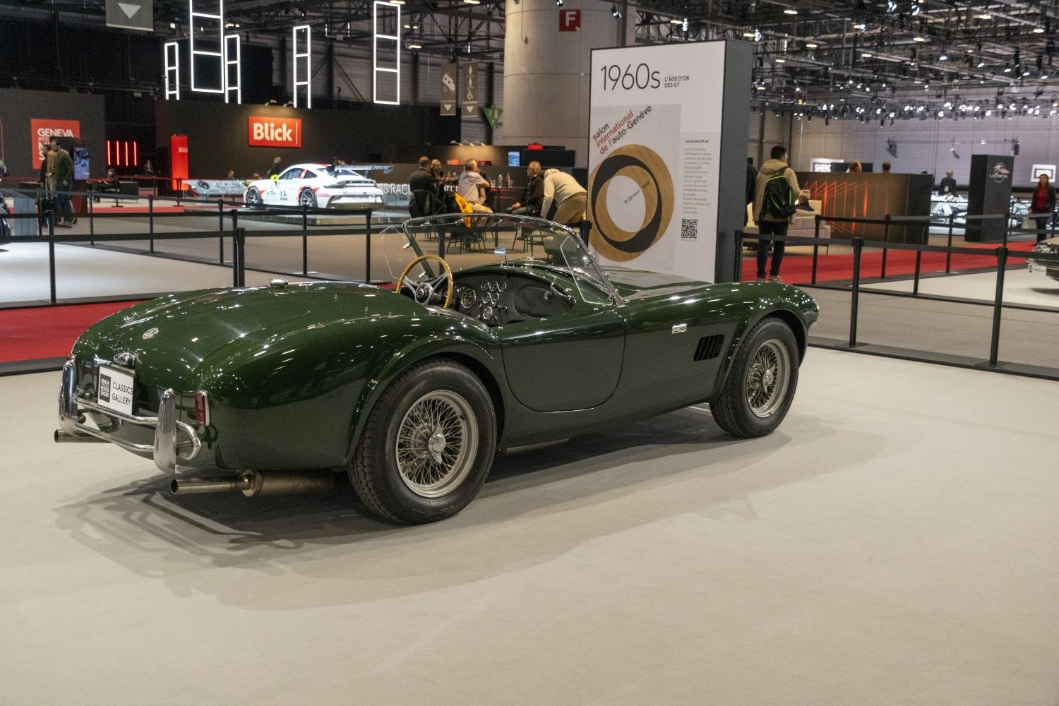 Vintage green roadster with wire spoke wheels and open cockpit