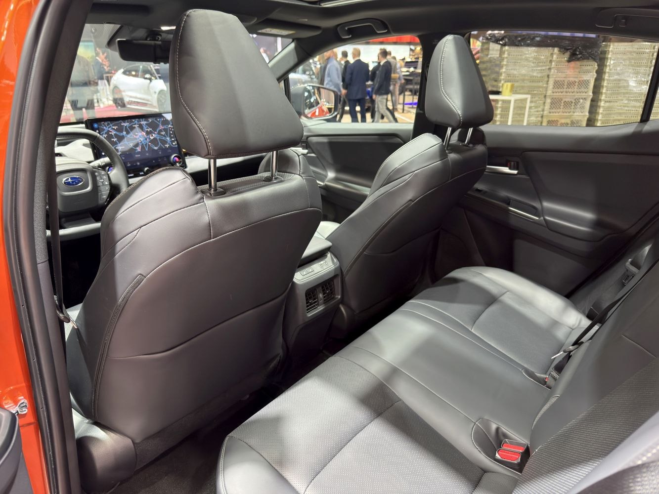 Rear seats and interior layout with leather upholstery and advanced dashboard view.