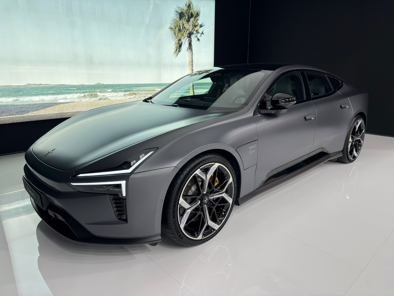 Sharp LED headlights and polished alloy wheels on an aerodynamic luxury sedan.