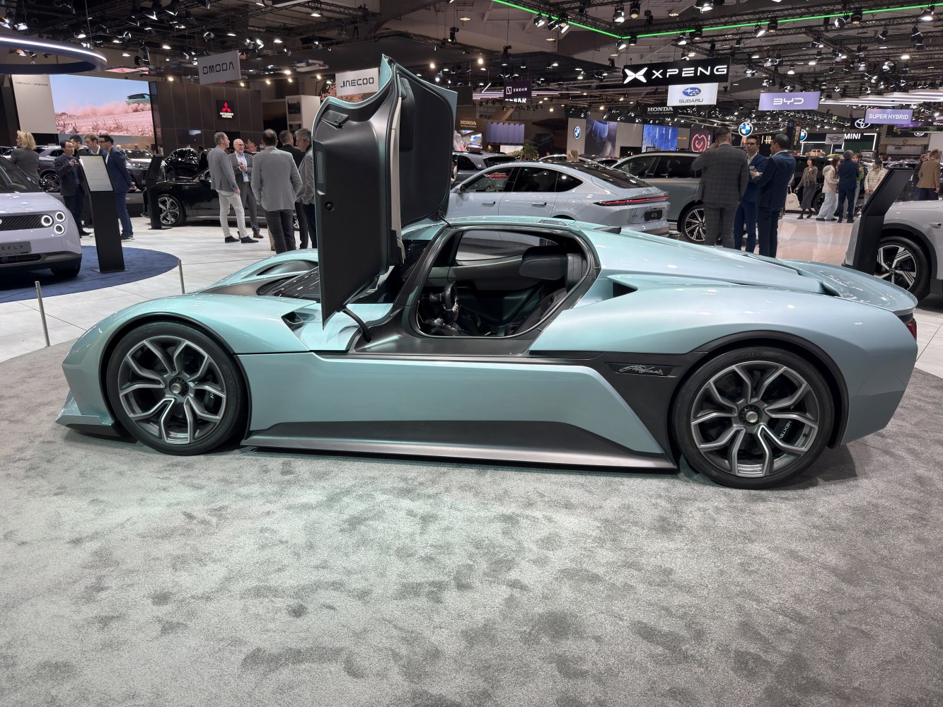 Electric supercar with butterfly doors and aerodynamic body
