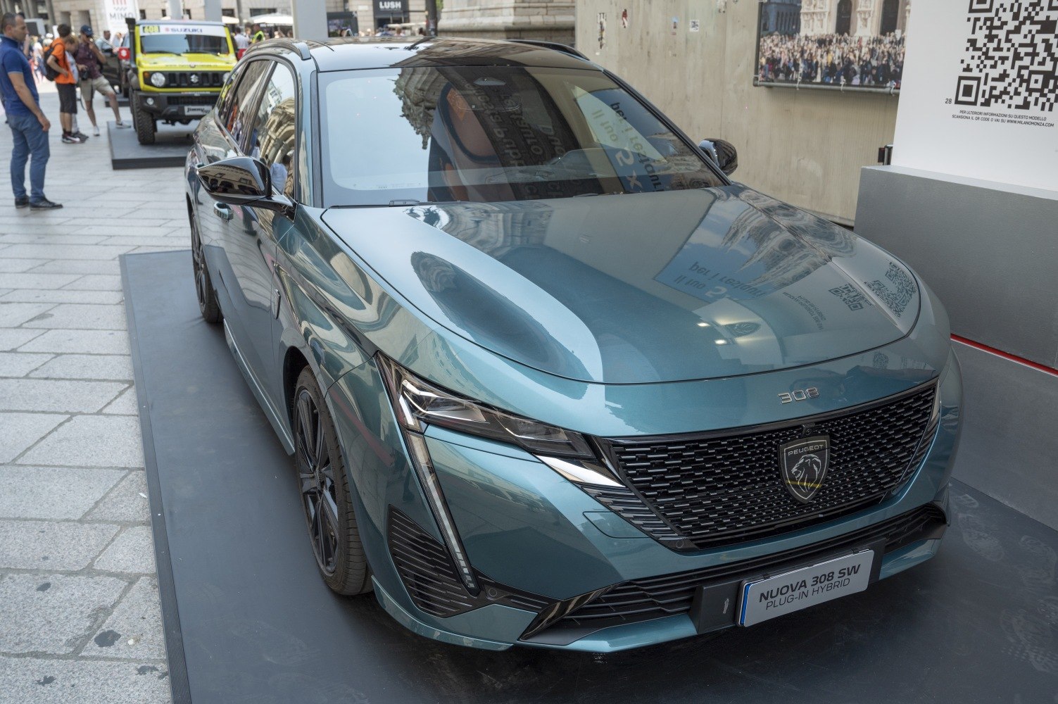 Sleek front grille and sharp LED headlights of a modern vehicle.