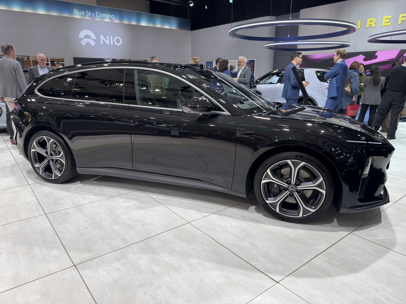 Aerodynamic black wagon with polished alloy five-spoke wheels