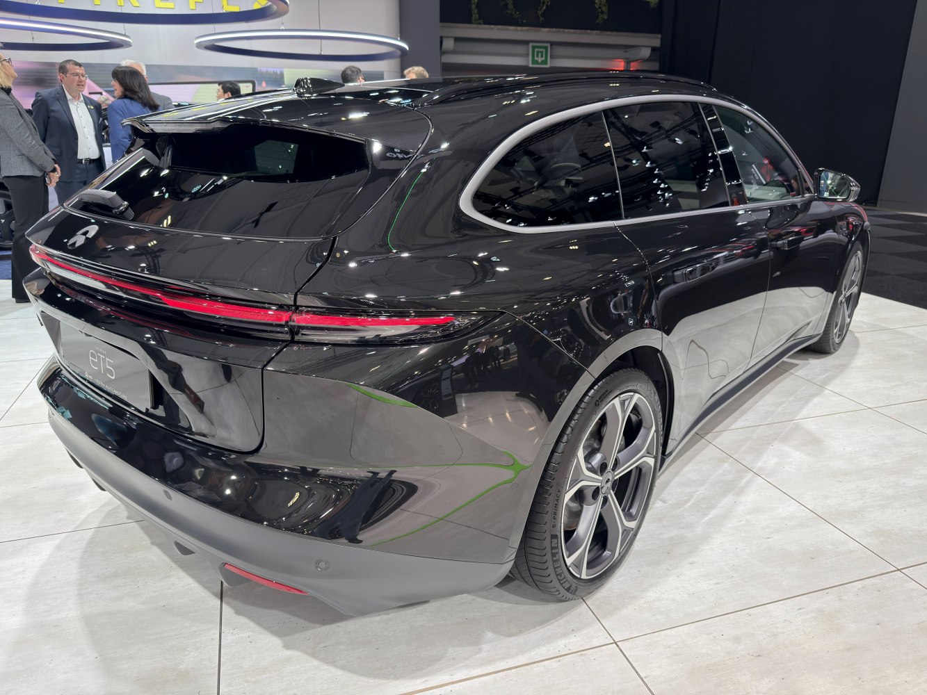 Sleek rear design and continuous LED taillights on a touring hatchback