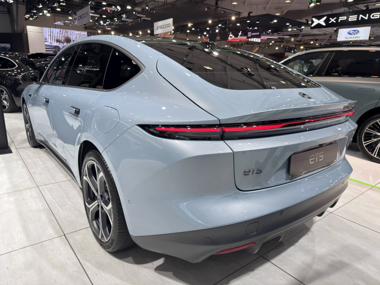 Rear view with continuous LED light strip and aerodynamic design.