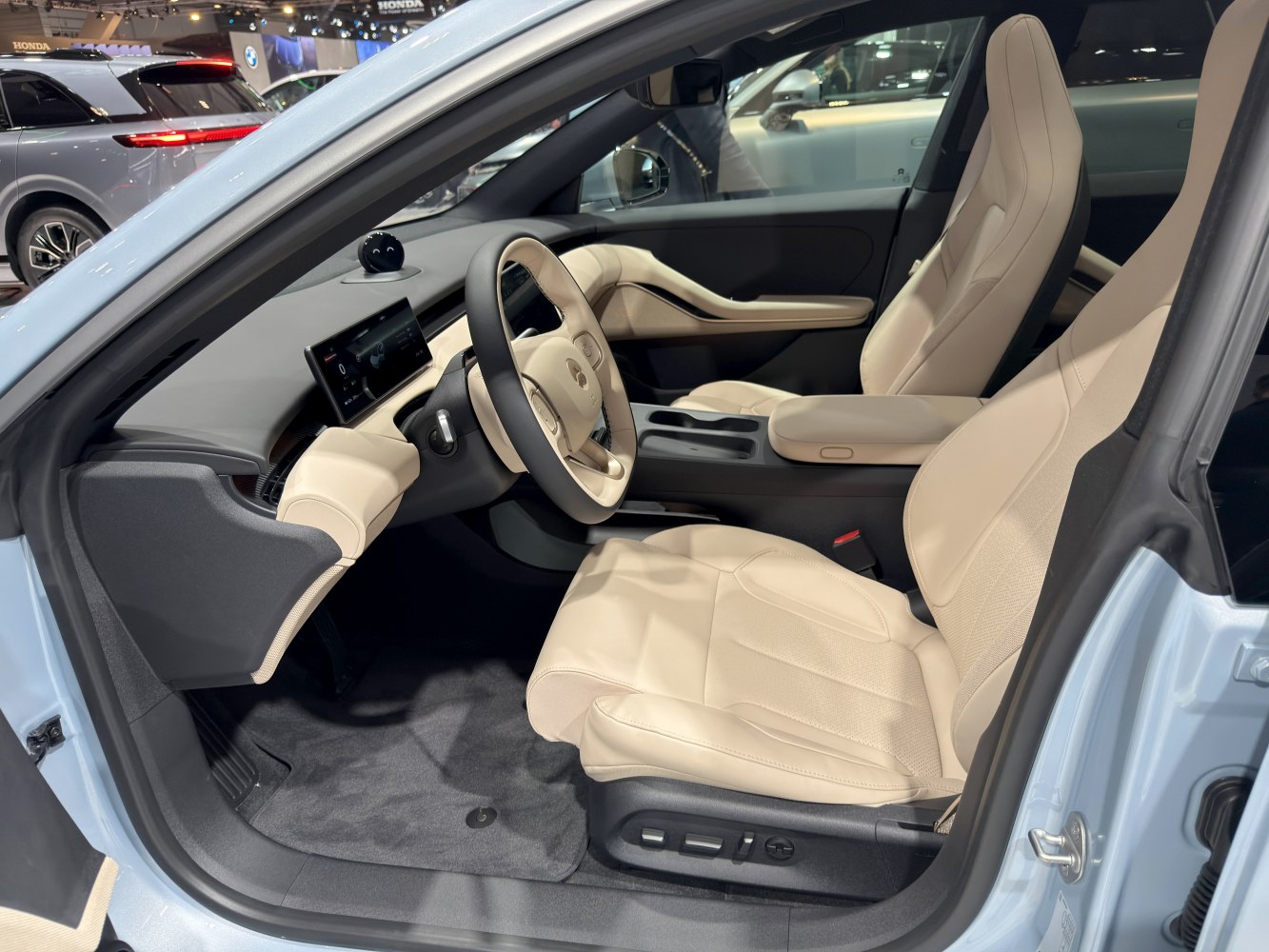 Beige leather interior with digital dashboard and power-adjustable seats