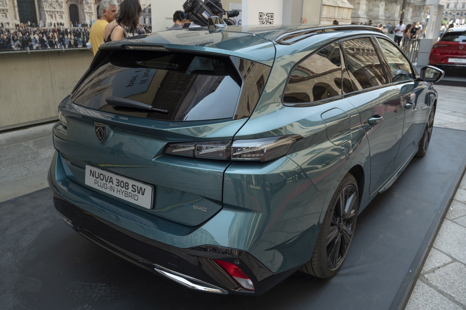 Rear view with sleek taillights and hybrid badge on modern station wagon