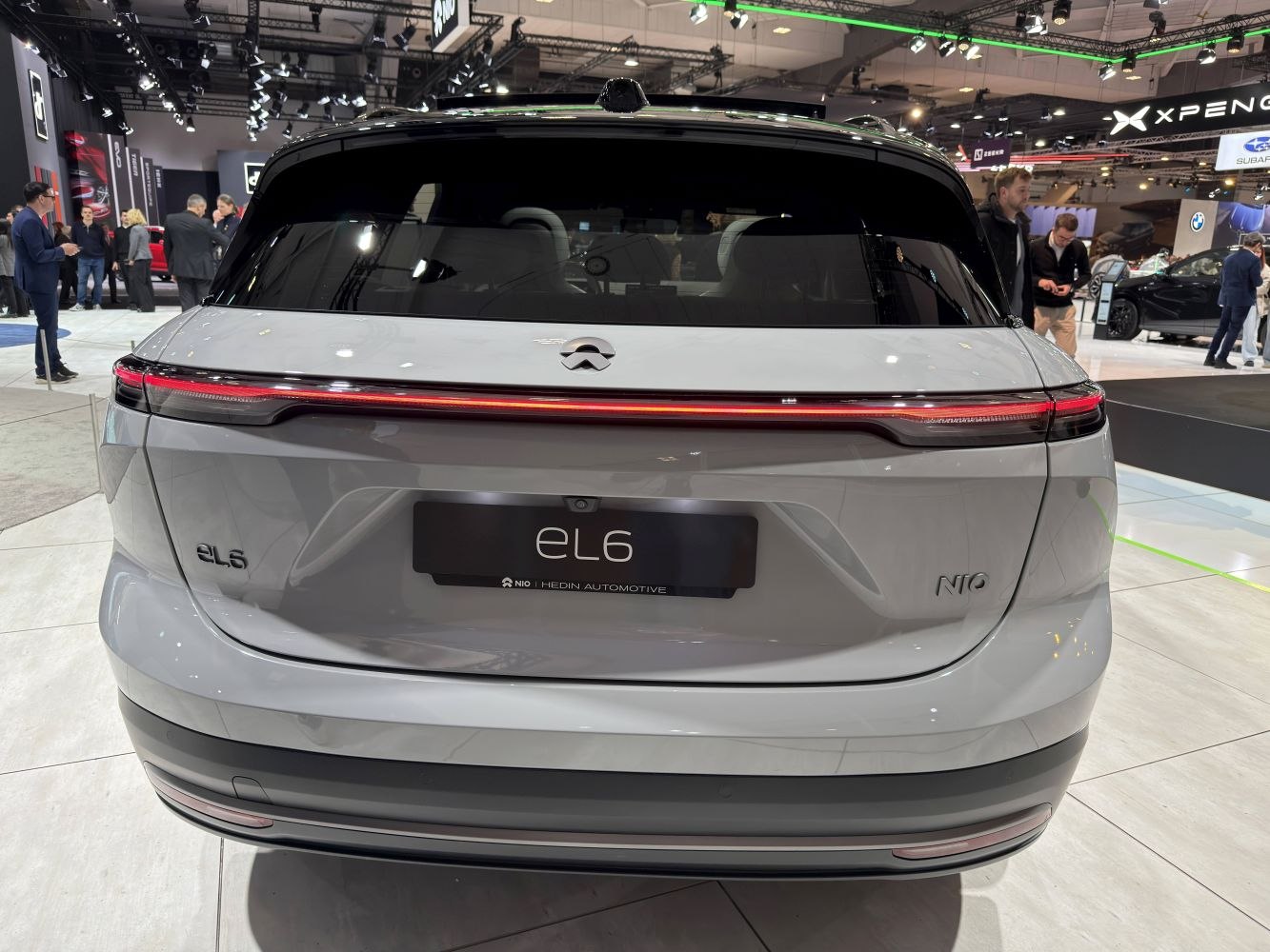 Rear view with continuous LED tail light and smooth rear hatch.