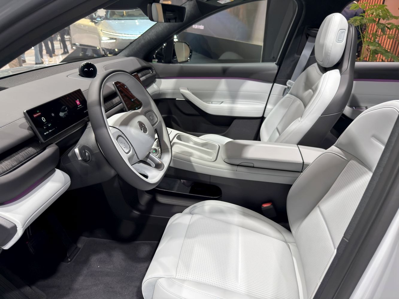 Digital dashboard and white leather seats with modern design