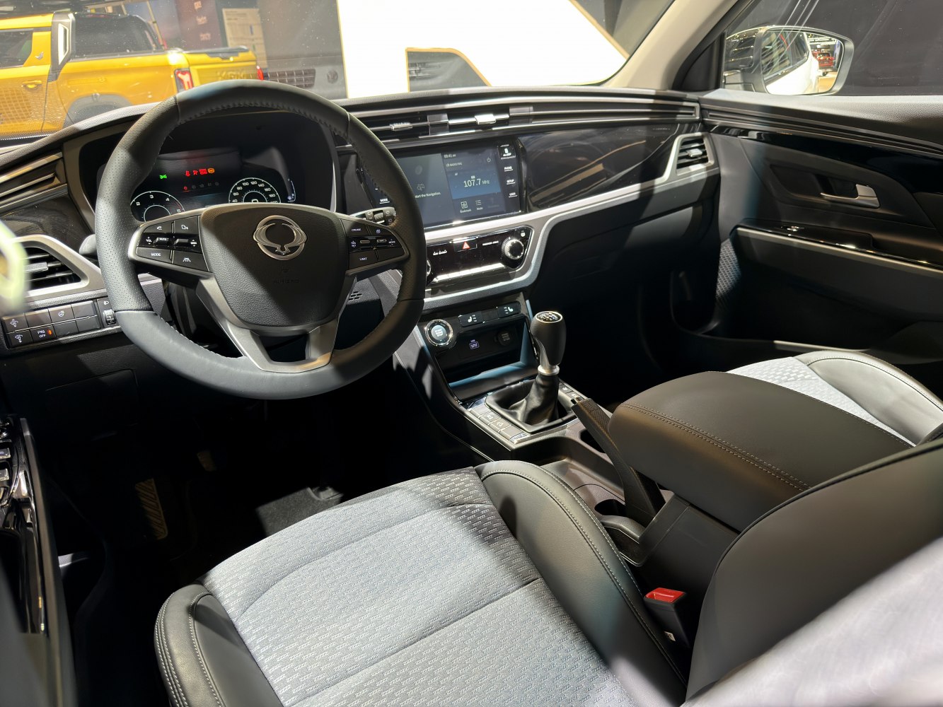 Manual transmission and digital instrument cluster in modern dashboard