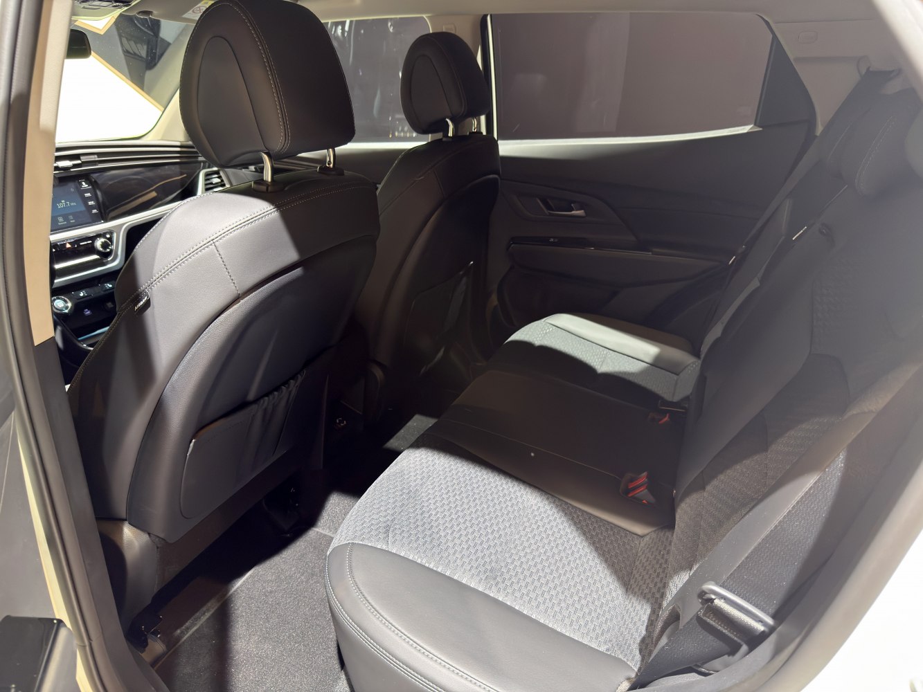 Spacious rear passenger seats with premium upholstery and modern design
