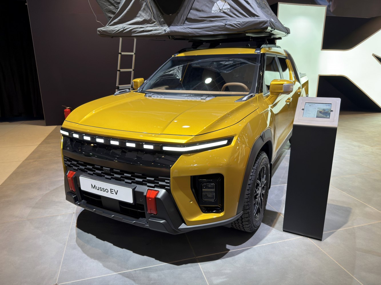 Electric pickup with roof tent and modern front lighting