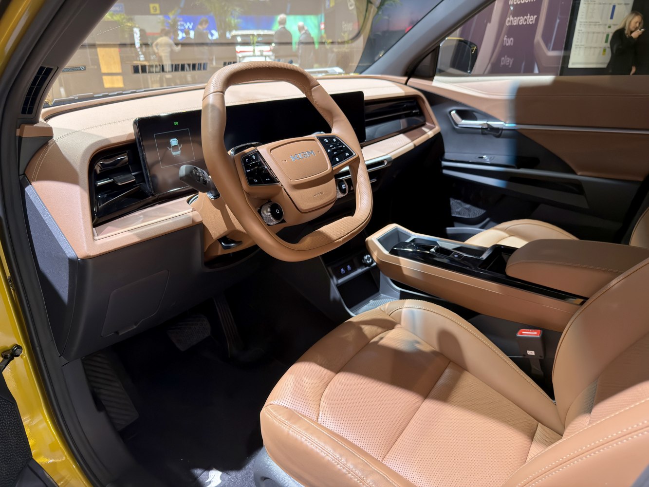 Digital dashboard and brown leather seats in modern car interior